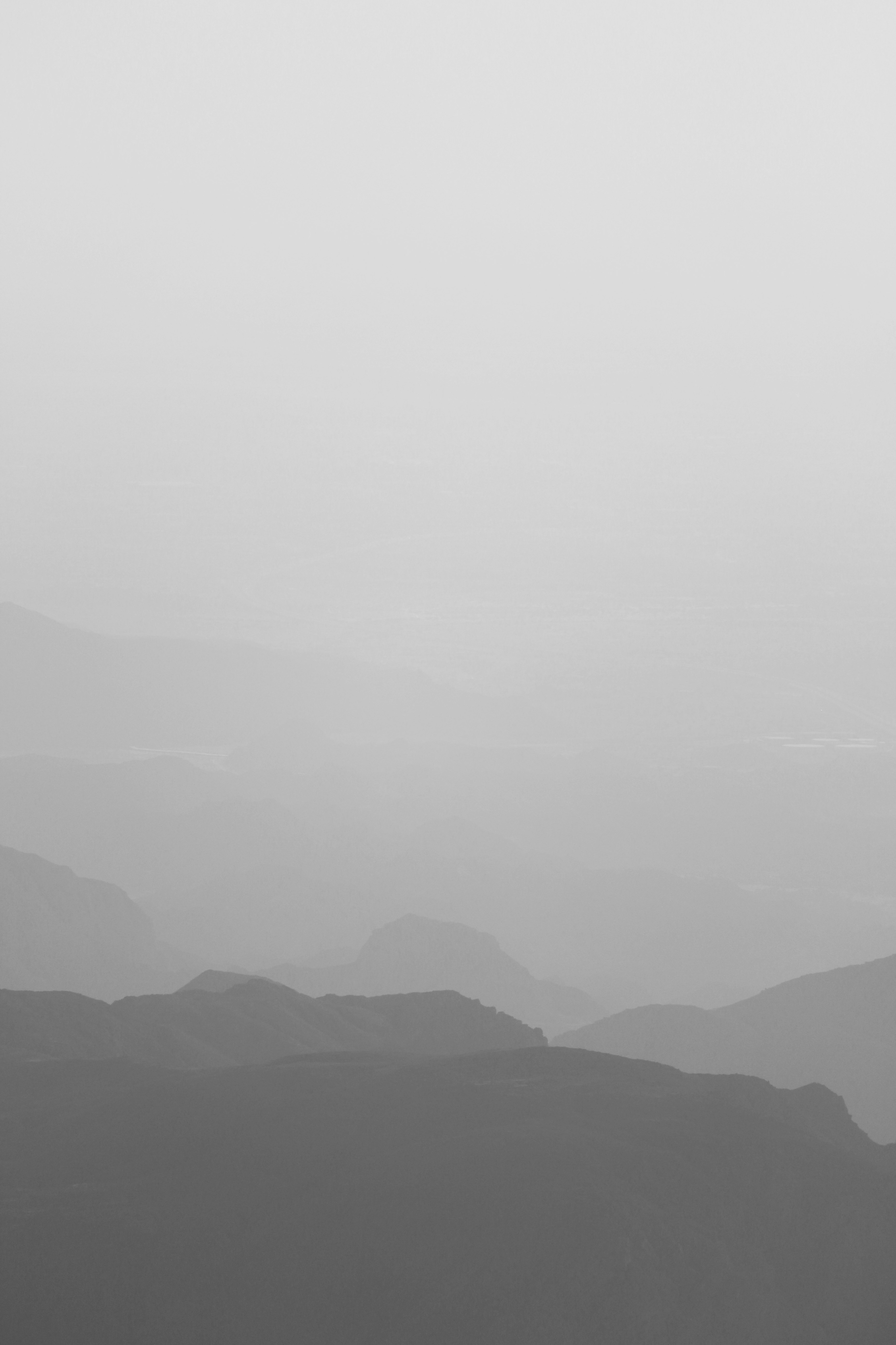 mountains under white sky during daytime